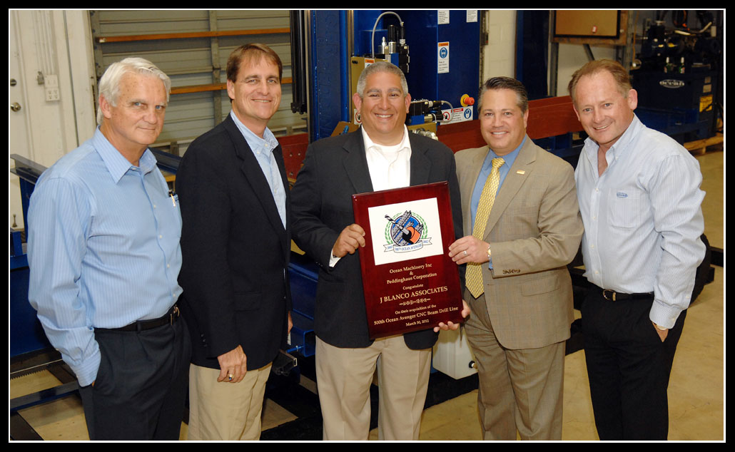 Jack Seiler and Chip LaMarca present the 500th Ocean Avenger plaque to Victor Ramos