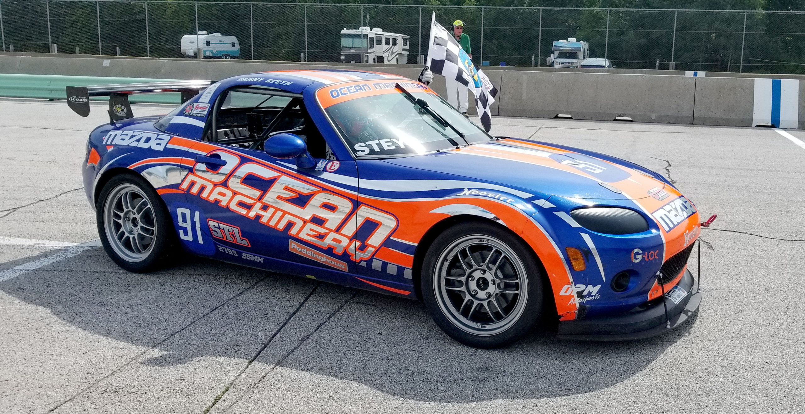 Proudly displaying the checkered flag after back-to-back victories at 2018 SCCA June Sprints