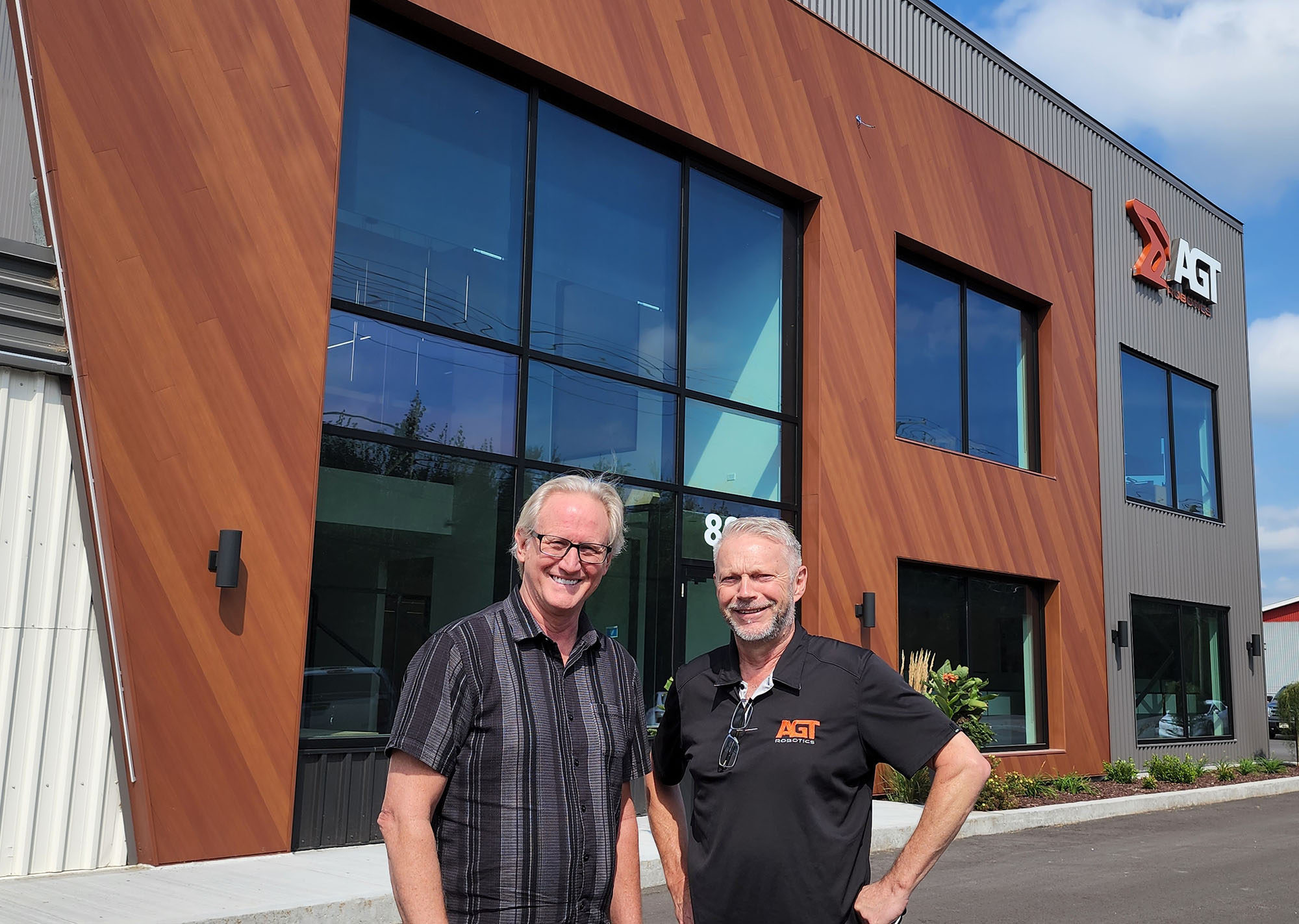 Ocean Machinery COO, Damon Chandler and AGT Robotics US Sales Manager, Gordon Attridge outside the newly expanded AGT facility in Trois Rivieres.